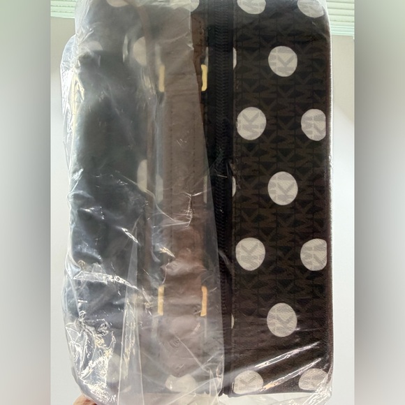 MICHAEL KORS Small Polka Dot Signature Logo Suitcase
$898 OUT OF STOCK - Picture 11 of 12